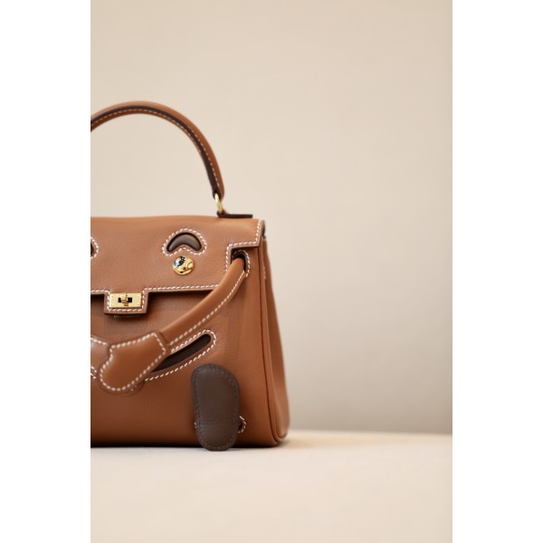 Kelly dolly material using swift cowhide gold brown spell coffee