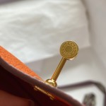 mini. lindy. classic orange and gold buckle top hand sewing custom