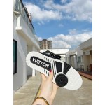 Louis Vuitton with four leaf clover pattern on the side of the shoe