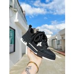 Louis Vuitton with four leaf clover pattern on the side of the shoe