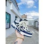 Louis Vuitton with four leaf clover pattern on the side of the shoe