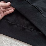 Prada's iconic iron brand hardware round neck sweater