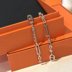Hermes Pig Nose Asymmetric Tassel Earrings